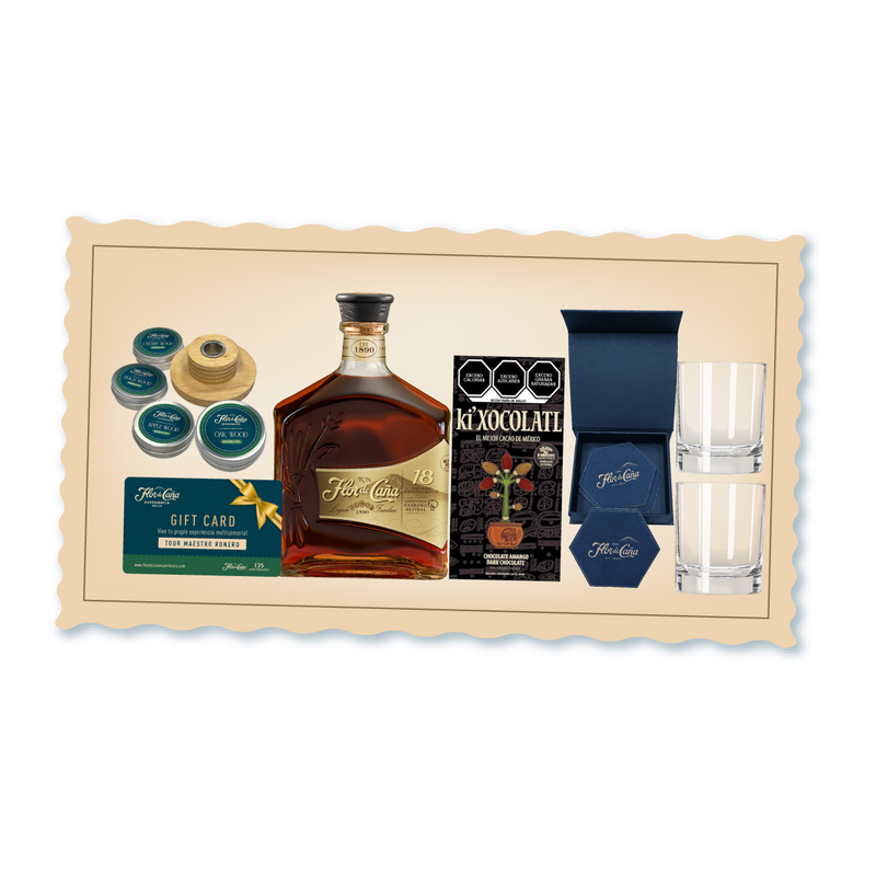 <h3><span style="color: rgb(0, 61, 77);">Descubre una experiencia sensorial completa con esta curación exclusiva que combina el refinamiento del Ron Flor de Caña 18 años con complementos cuidadosamente seleccionados.</span></h3>
<p> </p>
<p>Incluye acceso al Tour Maestro Ronero para profundizar en el arte de la destilación, chocolate semi-amargo de 70% para deleitar el paladar, 4 posavasos de cuero azul, 2 vasos old fashion y un Smoke Top y 4 wood chips de sabores. Una propuesta integral para el conocedor que valora tanto la calidad del espíritu como los detalles que enriquecen la experiencia.</p>
<p> </p>
<p>• Ron Flor de Caña 18 años 750 ml</p>
<p>• Chocolate Semi-Amargo 70%</p>
<p>• Posa vasos de cuero azul</p>
<p>• Set de Ahumador + 4 virutas de madera de sabores</p>
<p>• Set 2 vasos old fashion</p>
<p>• Un cupón para 2 personas para disfrutar de nuestro exclusivo Tour Maestro Ronero.</p>
<p>• Una canasta práctica, ideal para reutilizar y guardar más detalles especiales.</p>
<p> </p>
<p><span style="color: rgb(39, 97, 67);"><strong>Incluye un regalo navideño de Flor de Caña 135 aniversario.</strong></span></p>